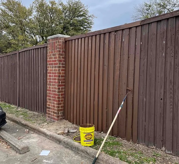 Vertical wood privacy fence with brick column