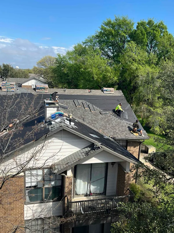 LSR crew installing new shingles on multifamily property