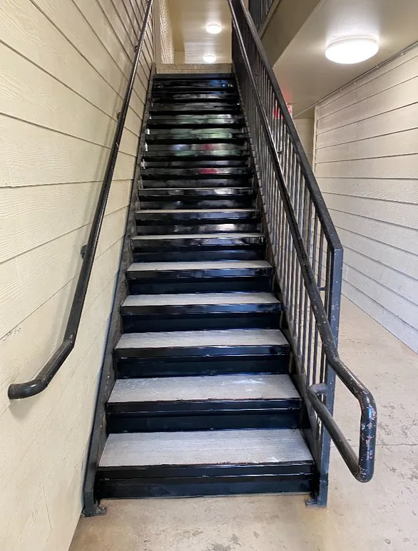 Custom black metal staircase with non-slip treads